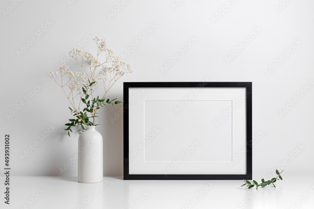 Fotografie Horizontal frame in white minimalistic interior with flowers decorations
