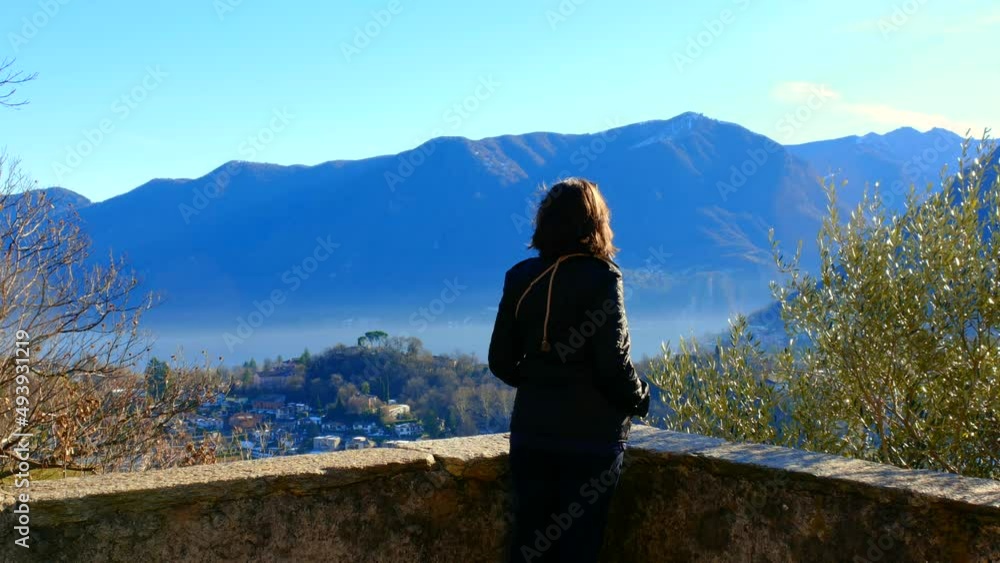 Woman Joy Mountain View over Lake Lugano in a Sunny Day and Cityscape in Lugano, Ticino, Switzerland. Woman Joy Mountain View over Lake Lugano in a Sunny Day and Cityscape in Lugano, Ticino, Switzerland.