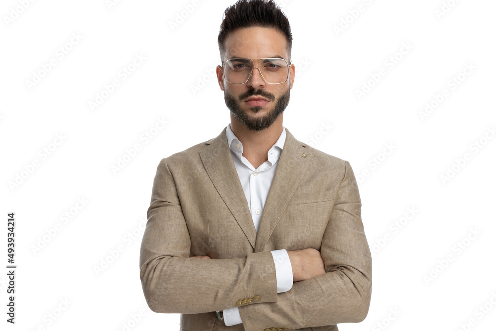 businessman posing with his arms crossed at chest businessman posing with his arms crossed at chest