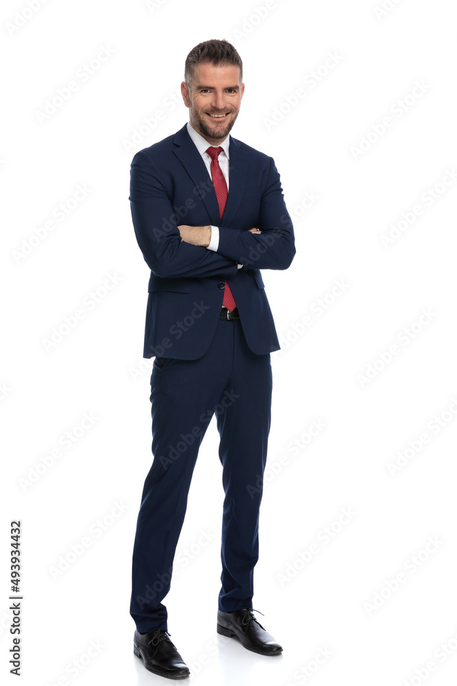full body picture of elegant businessman crossing arms and smiling full body picture of elegant businessman crossing arms and smiling