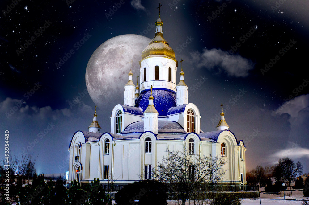 Φωτογραφία Night church in Ukraine against the background of the full moon and the starry s