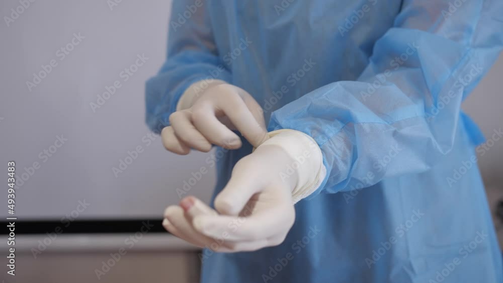 The doctor wears rubber gloves The doctor wears rubber gloves