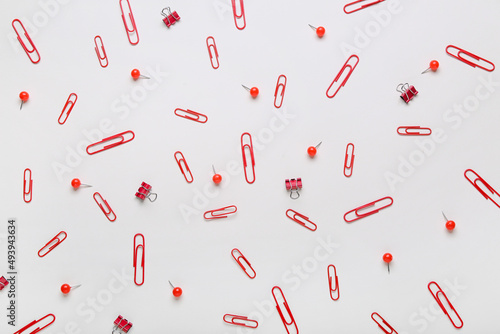 Composition with clips and pins on white background