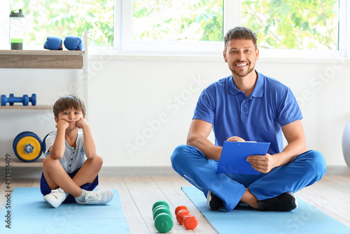 Male trainer with clipboard...