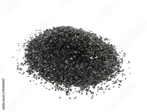 Pile of coconut activated carbon on white background