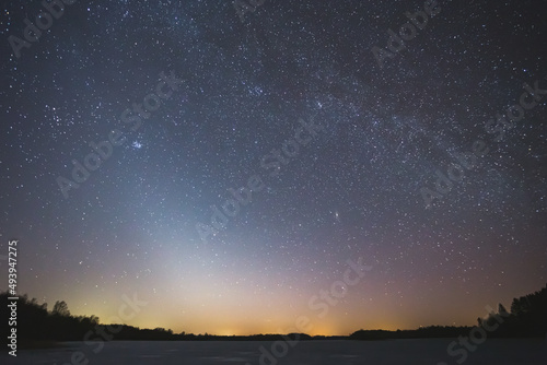 Night landscape image with colorful milky way and zodiac light in the horizon
