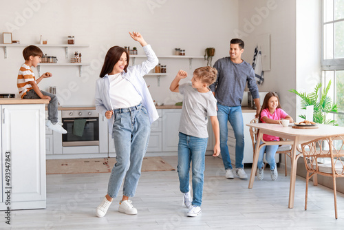 Happy  family dancing in ki...