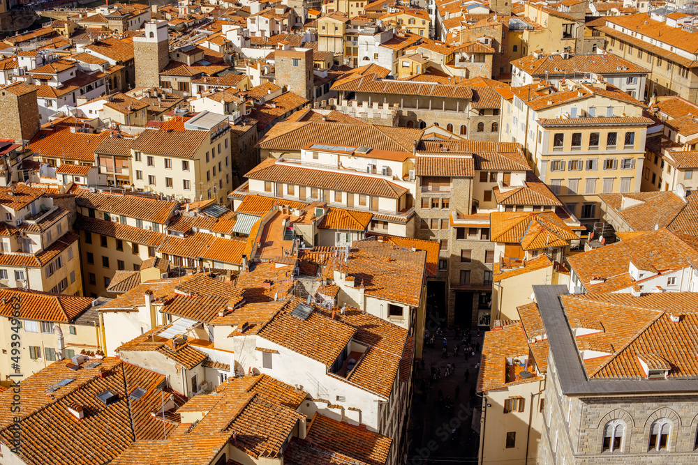 Aerial view on the beautiful rooftops of ancient houses and streets in Florence on sunny day
