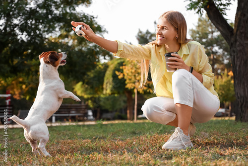 Young woman playing with cu...