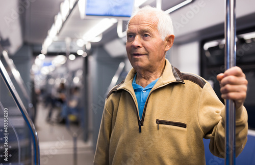 Portrait of man traveling by modern city subway car © caftor