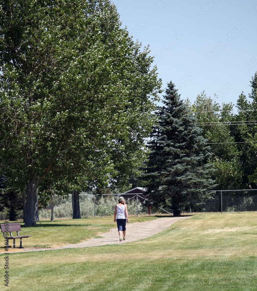 Mature female senior on walking trail outdoors. Mature female senior on walking trail outdoors.