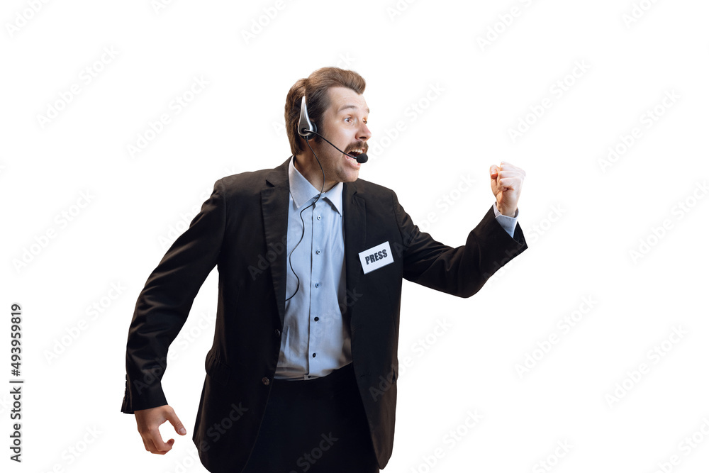 Emotive young man, professional sport commentator, journalist with microphone broadcasting football match isolated over white background. Sport, news concept Emotive young man, professional sport commentator, journalist with microphone broadcasting football match isolated over white background. Sport, news concept