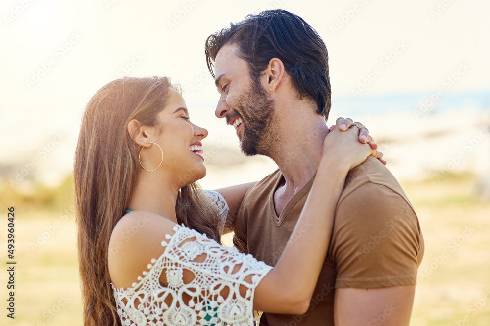 They only have eyes for each other. Shot of a smiling young couple embracing while enjoying a day together at the park. They only have eyes for each other. Shot of a smiling young couple embracing while enjoying a day together at the park.