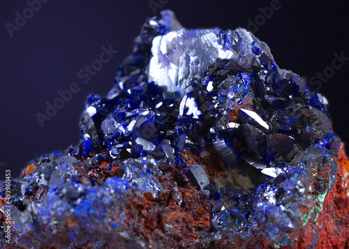 Close-up shot of azurite stone mineral specimen isolated on gray background photo