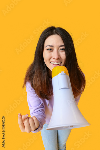 Young Asian woman with mega...
