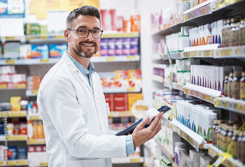 Weve got a brand new range of stock in. Portrait of a mature pharmacist doing inventory in a pharmacy. © Thurstan Hinrichsen/peopleimages.com