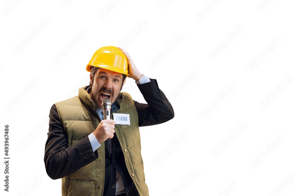 Portrait of young man in helmet, professional commentator, journalist with microphone broadcasting isolated over white background. News, emotions, job concept Portrait of young man in helmet, professional commentator, journalist with microphone broadcasting isolated over white background. News, emotions, job concept