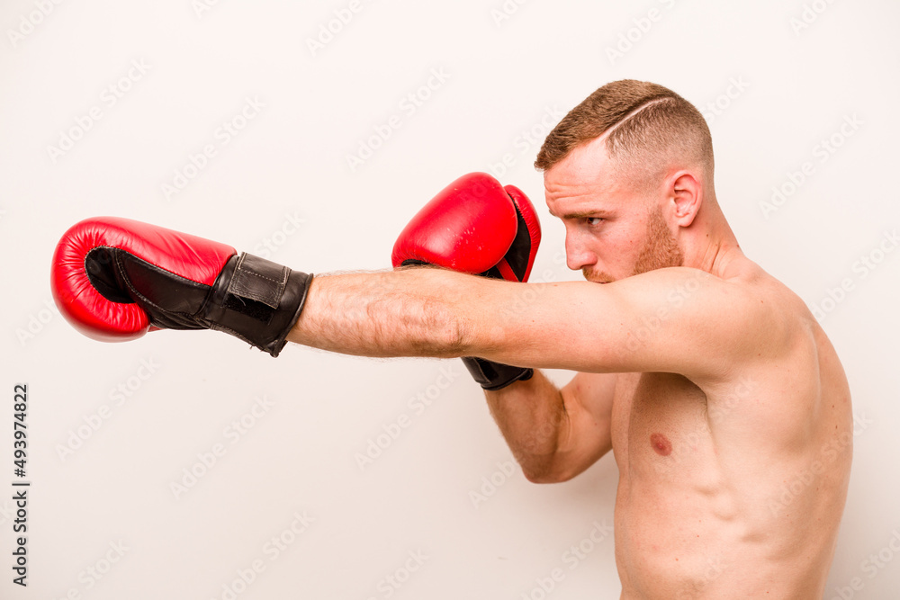 Young caucasian man doing boxing isolated on white background