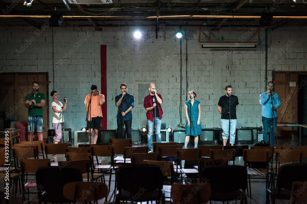 Behind the scenes. Rehearsal at theatre with large actors group Behind the scenes. Rehearsal at theatre with large actors group
