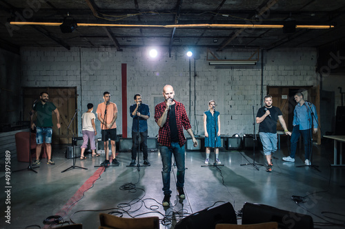 Behind the scenes. Rehearsal at theatre with large actors group © guruXOX