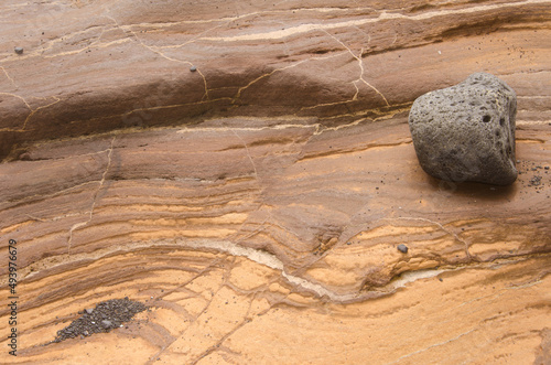 Rock surface showing different strata and rock. Montana Clara. Integral Natural Reserve of Los Islotes. Canary Islands. Spain. photo