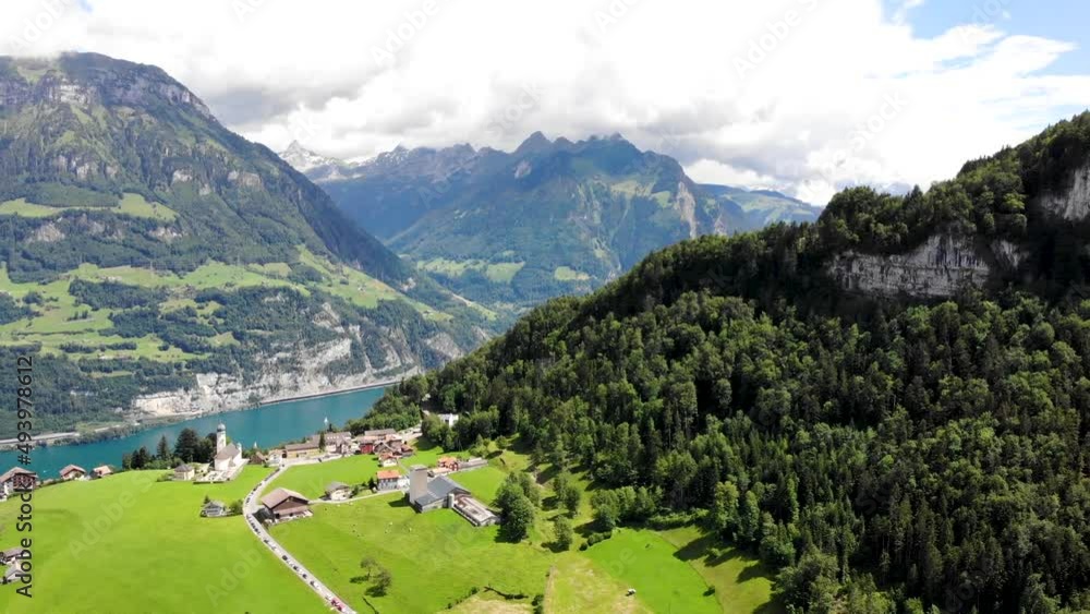 Aerial flyover over the village of Seelisberg with a spinning panoramic view of Lake Lucerne and various mountain peaks around Uri, Switzerland such as Niederbauen- Chulm, Fronalpstock, Pilatus Aerial flyover over the village of Seelisberg with a spinning panoramic view of Lake Lucerne and various mountain peaks around Uri, Switzerland such as Niederbauen- Chulm, Fronalpstock, Pilatus