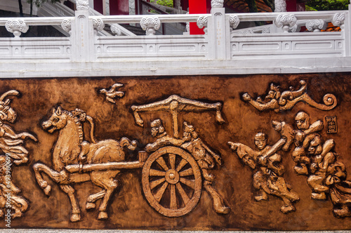 View of old bas-relief on the wall in Wen wu temple photo