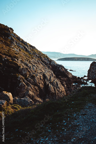 Ertical shot of a beautiful view through the rocks to the sea photo