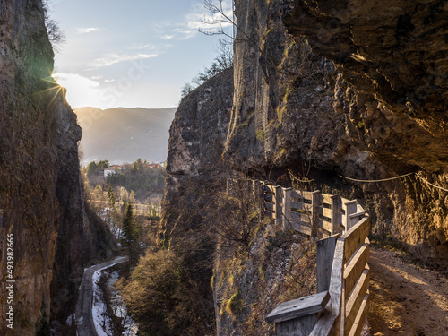 Empty route with wooden railings leading to the Sanctuary of San Romedio photo