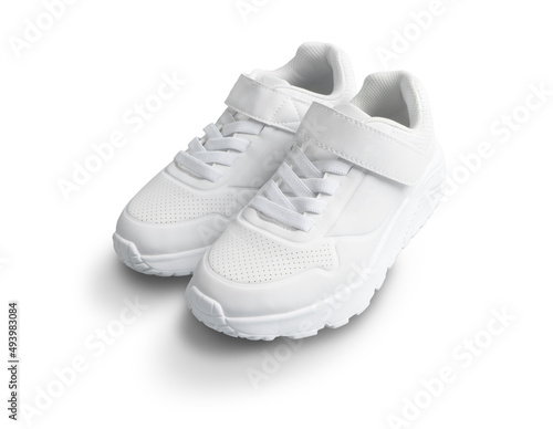 Foto white kid sneakers with velcro isolated on white background