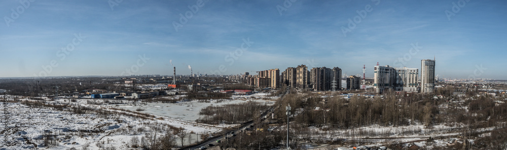 Fototapeta premium panorama of new buildings on the outskirts of the city against the sky close-up