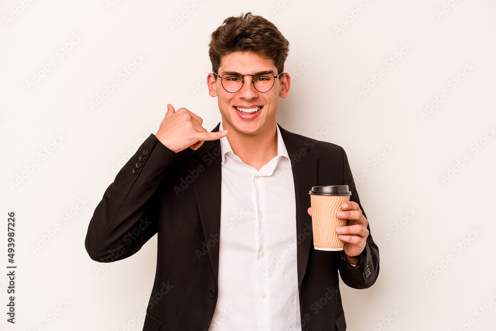 Young caucasian business man holding takeaway coffee isolated on white background showing a mobile phone call gesture with fingers. Young caucasian business man holding takeaway coffee isolated on white background showing a mobile phone call gesture with fingers.