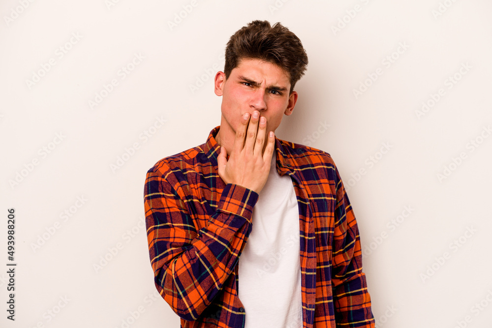 Young caucasian man isolated on white background shocked, covering mouth with hands, anxious to discover something new. Young caucasian man isolated on white background shocked, covering mouth with hands, anxious to discover something new.