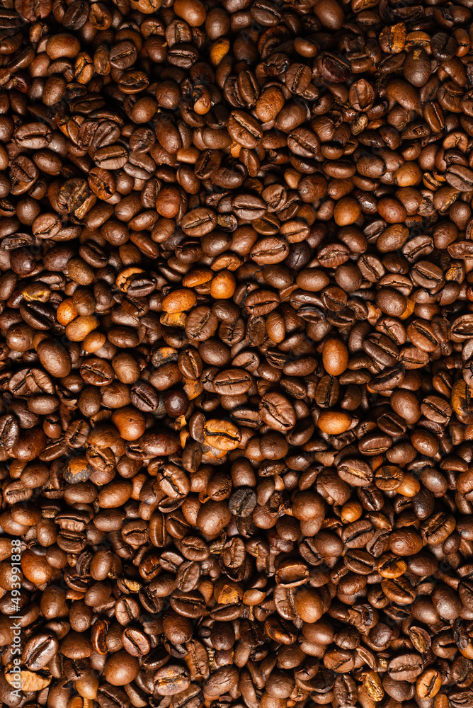 Fototapeta premium Coffee beans on a white background. Top view.