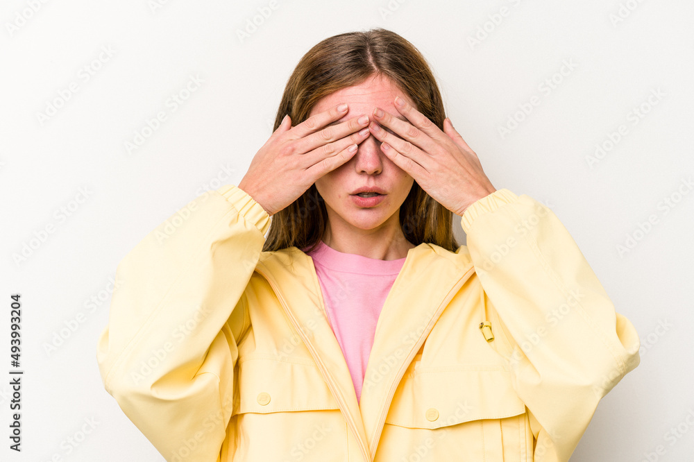 Young English woman isolated on white background afraid covering eyes with hands. Young English woman isolated on white background afraid covering eyes with hands.