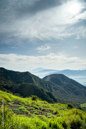 View of Indonesia's mountains with wide green grass