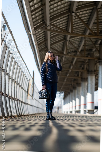Woman walking on the railway station.