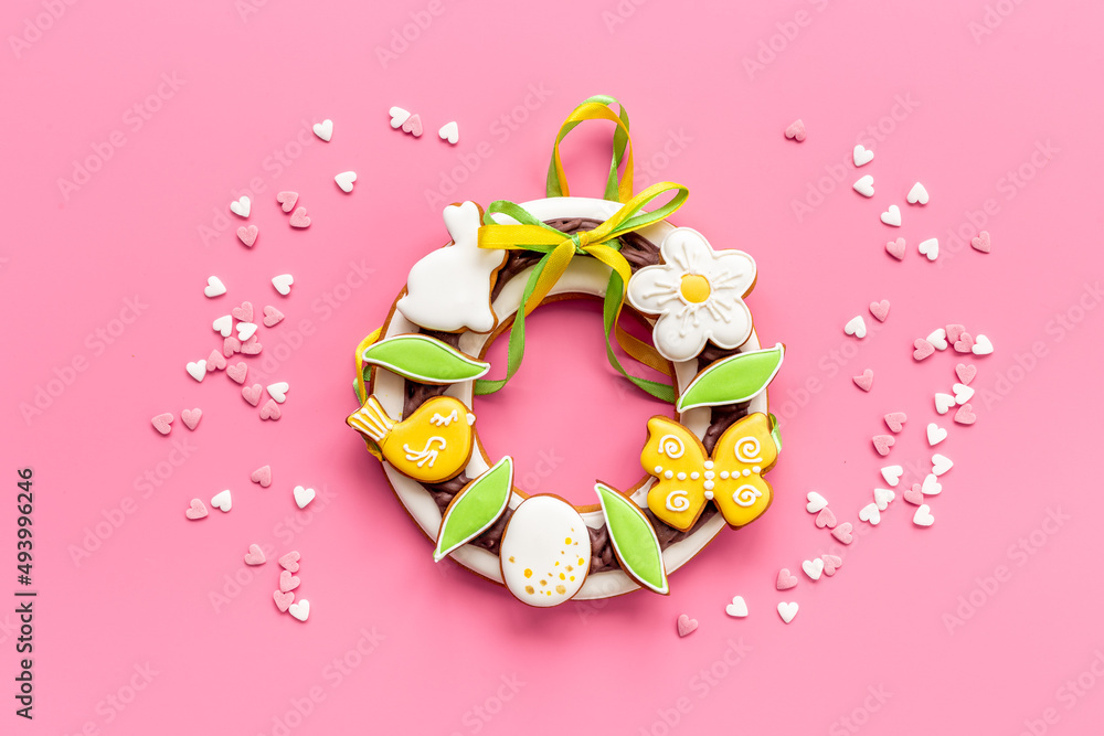 Easter sweet wreath made of bunny and eggs cookies, top view Easter sweet wreath made of bunny and eggs cookies, top view