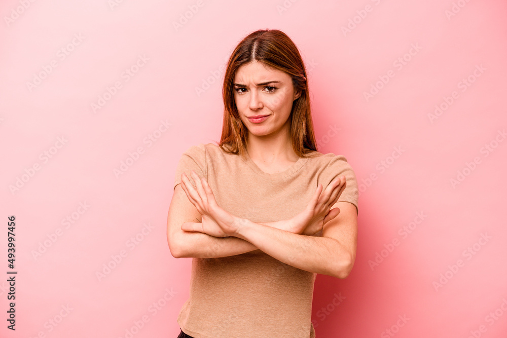 Young caucasian woman isolated on pink background doing a denial gesture Young caucasian woman isolated on pink background doing a denial gesture