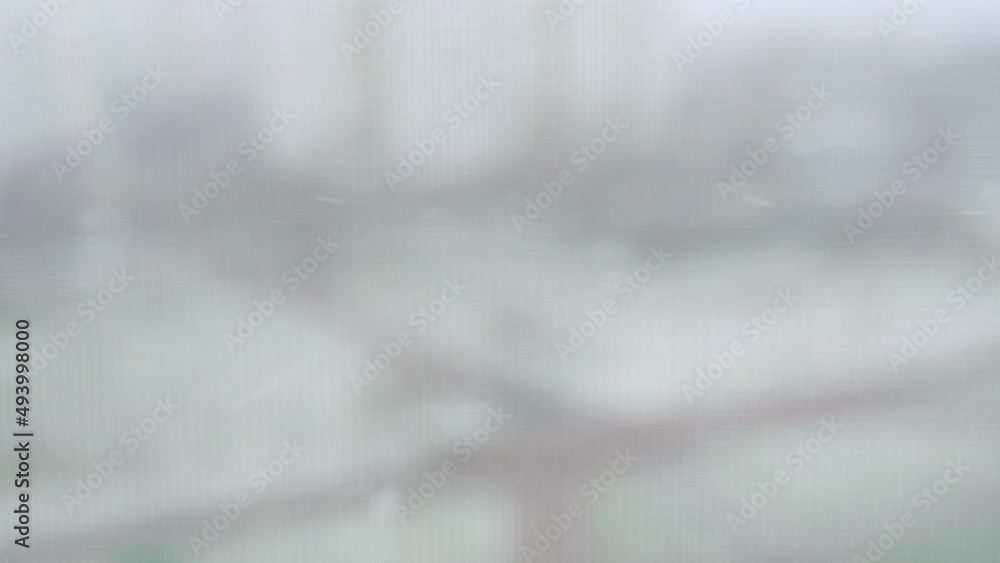 Falling snow outside the window and drops Falling snow outside the window and drops