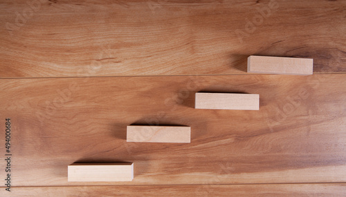 Wooden blocks stacking as step stair