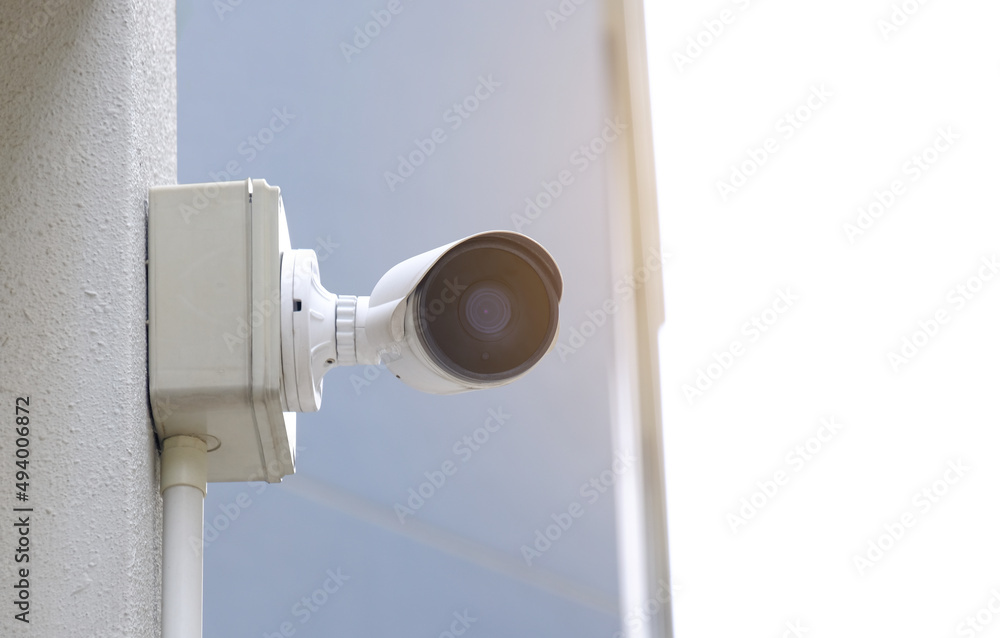 Modern public CCTV camera on blur building background. Recording cameras for monitoring all day and night. Concept of surveillance and monitoring with copy space. Modern public CCTV camera on blur building background. Recording cameras for monitoring all day and night. Concept of surveillance and monitoring with copy space.