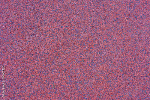 Interior rubber flooring material in red shade using in fitness ,gymnasium or playground for prevent accident. Close up of soft floor texture background.