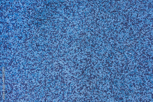 Interior rubber flooring material in blue shade using in fitness ,gymnasium or playground for prevent accident. Close up of soft floor texture background. photo