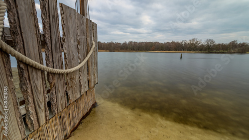 Wall with a rope leading into the silver lake, Germany, Lower Saxony, Hanover, Langenhagen photo