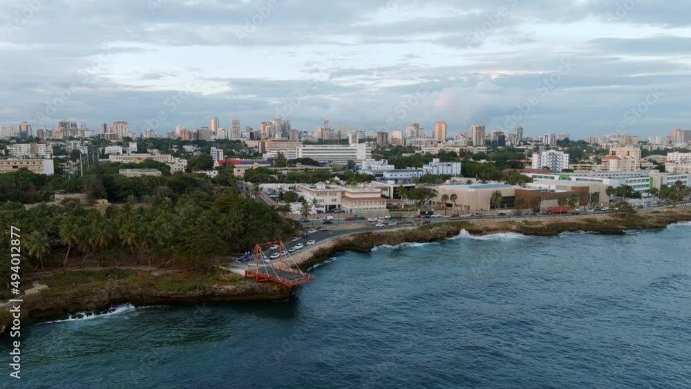 Rocky coast of Malecon at dusk. Santo Domingo in Dominican Republic. Aerial forward Rocky coast of Malecon at dusk. Santo Domingo in Dominican Republic. Aerial forward