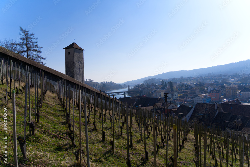 Aerial view over City of Schaffhausen with Rhine River and bridge seen from historic fortification named Munot on a sunny spring day. Photo taken March 5th, 2022, Schaffhausen, Switzerland.