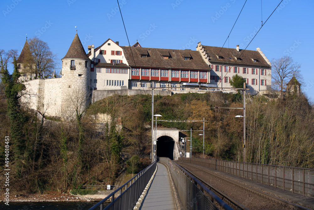 Laufen Castle on a hill above the famous Rhine Falls on a sunny spring day. Photo taken March 5th, 2022, Laufen-Uhwiesen, Switzerland. Laufen Castle on a hill above the famous Rhine Falls on a sunny spring day. Photo taken March 5th, 2022, Laufen-Uhwiesen, Switzerland.