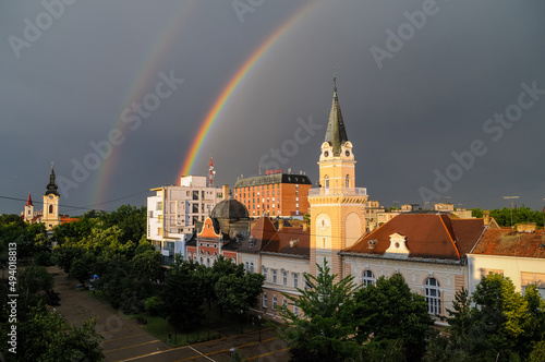 Scenic view of  rainbow over beautiful architectural buildings in Kikinda city in Serbia photo