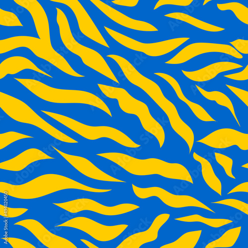 Yellow wavy stripes on a blue background. Seamless modern zebra pattern for trendy textured fabrics, paper products. 